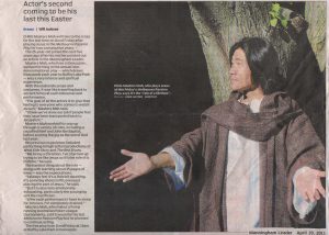 Newspaper article with photo of Chris Masters Mah in costume as Jesus under a tree