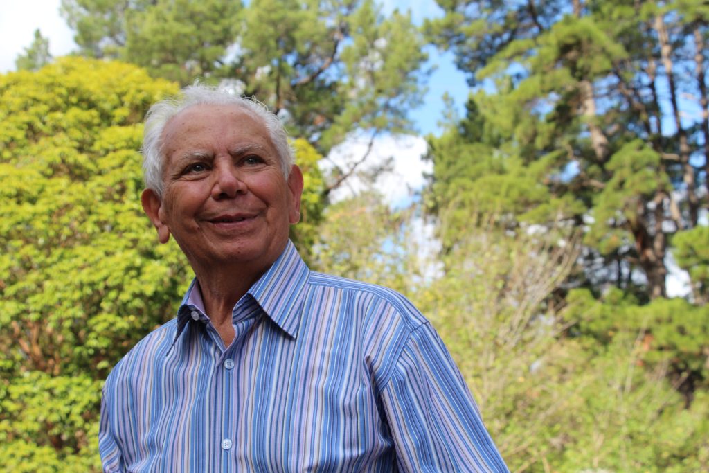 Founder Pat La Manna surrounded by trees